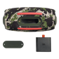 JBL Xtreme 4 portable Bluetooth speaker in camouflage color, open box, with rugged design and control buttons visible.