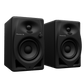 Pioneer DJ DM-40D desktop monitors showing sleek black speaker design with control knobs and front-facing speaker cones