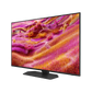 Open box Samsung 43-inch QN90F Series 4K UHD HDR Neo QLED Tizen Smart TV showing screen with vibrant image and sleek black frame.
