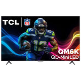 Open box TCL 75-inch QM6K Series 4K UHD HDR QD-Mini LED Smart Google TV displaying vibrant screen content.