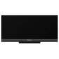 Open box TCL 65-inch Q7K Series 4K UHD HDR QLED Smart Google TV displaying a sleek, modern TV screen with vibrant colors.