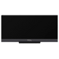 Open box TCL 85-inch Q7K Series 4K UHD HDR QLED Smart Google TV with sleek screen and remote control, fresh from packaging.