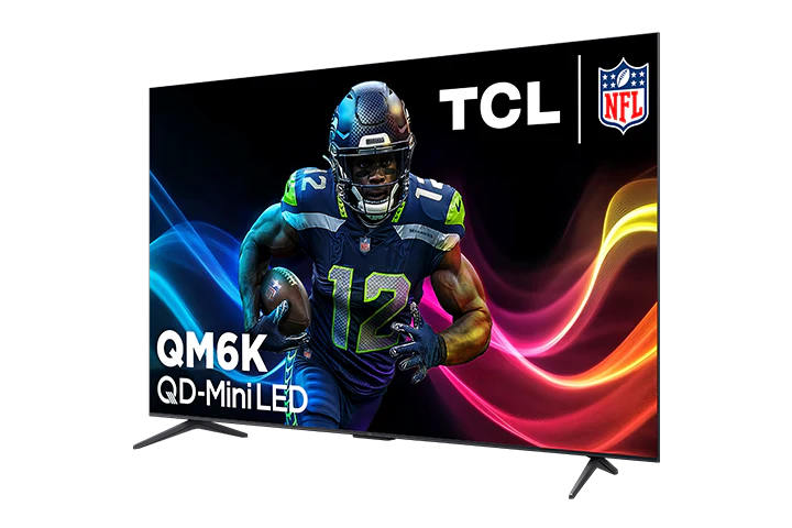 Open box TCL 85-inch QM6K Series 4K UHD HDR QD-Mini LED Smart Google TV displaying a high-resolution screen with vibrant colors.